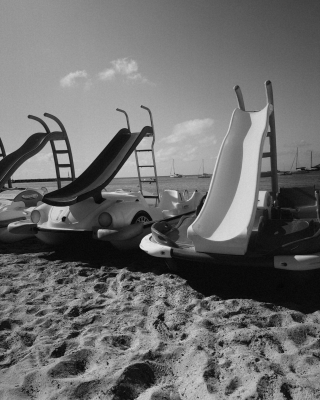 Pedalling away from the shore, jumping from the slide and climbing back up to do it all again. A simple summer ritual loved by generations of island kids.